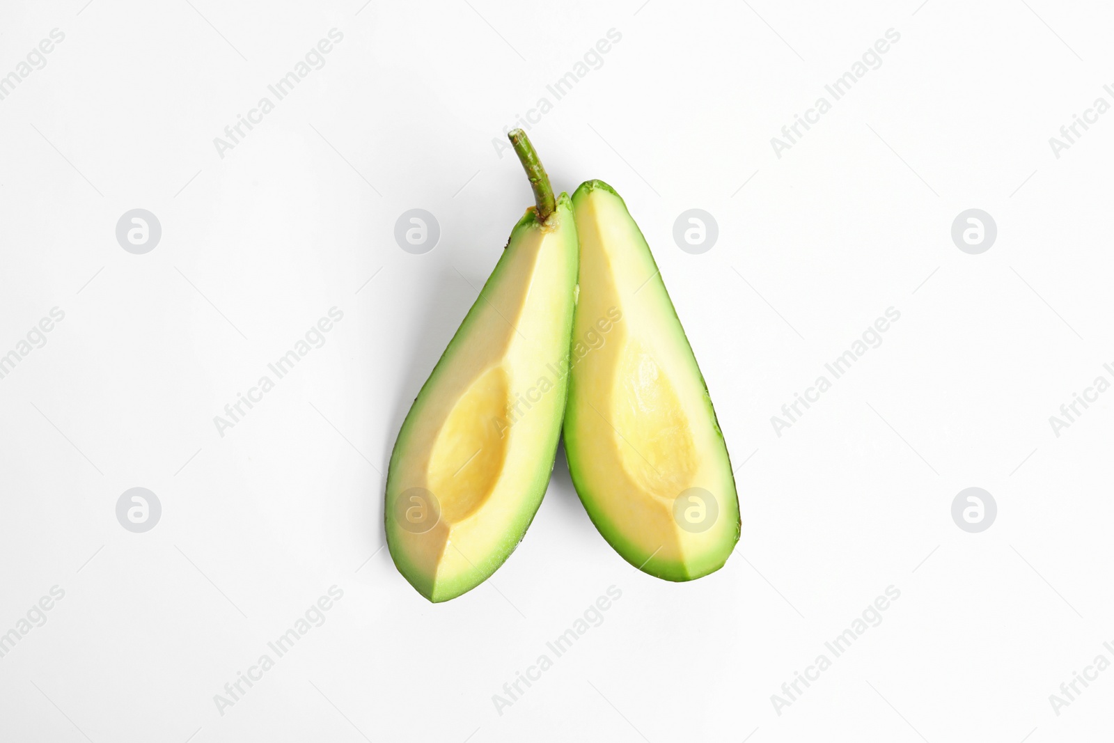 Photo of Slices of avocado on white background