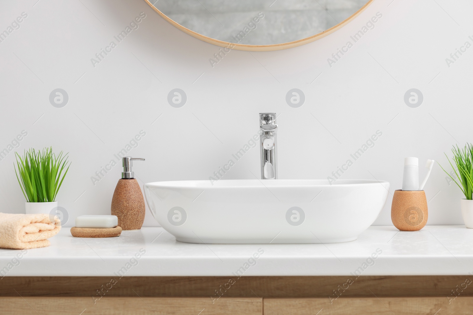 Photo of Set of different bath accessories and products on white table
