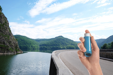 Image of Man with asthma inhaler and mountain road on background, closeup. First emergency medical aid