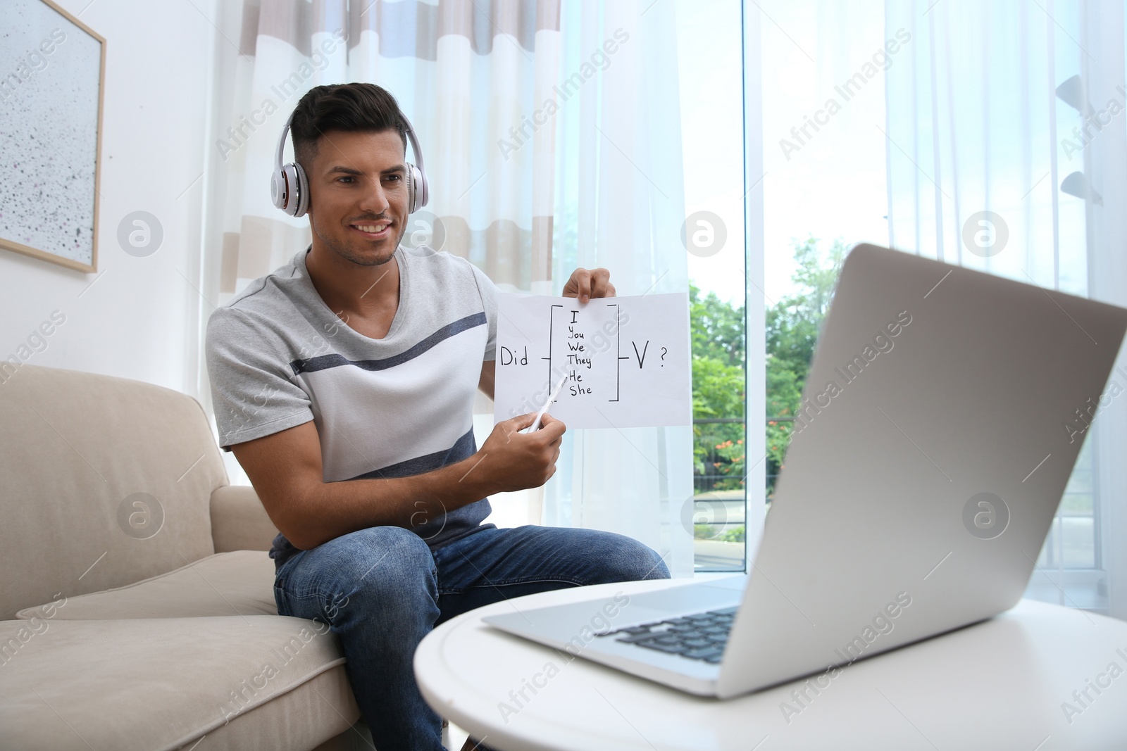 Photo of Teacher giving online lesson during quarantine. Studying at home