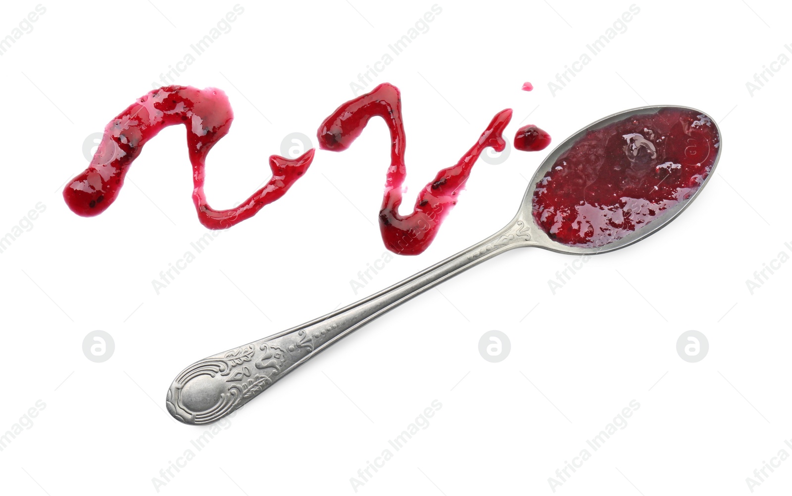 Photo of Tasty sweet jam and spoon isolated on white, top view