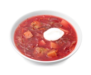 Photo of Tasty borscht with sour cream isolated on white