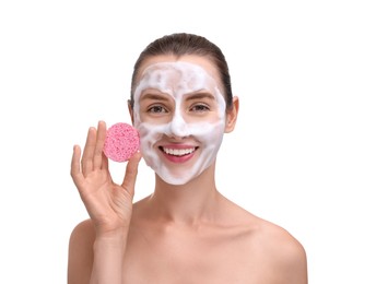 Photo of Happy young woman washing her face with sponge on white background