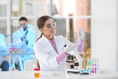 Photo of Young scientist working in laboratory. Chemical analysis