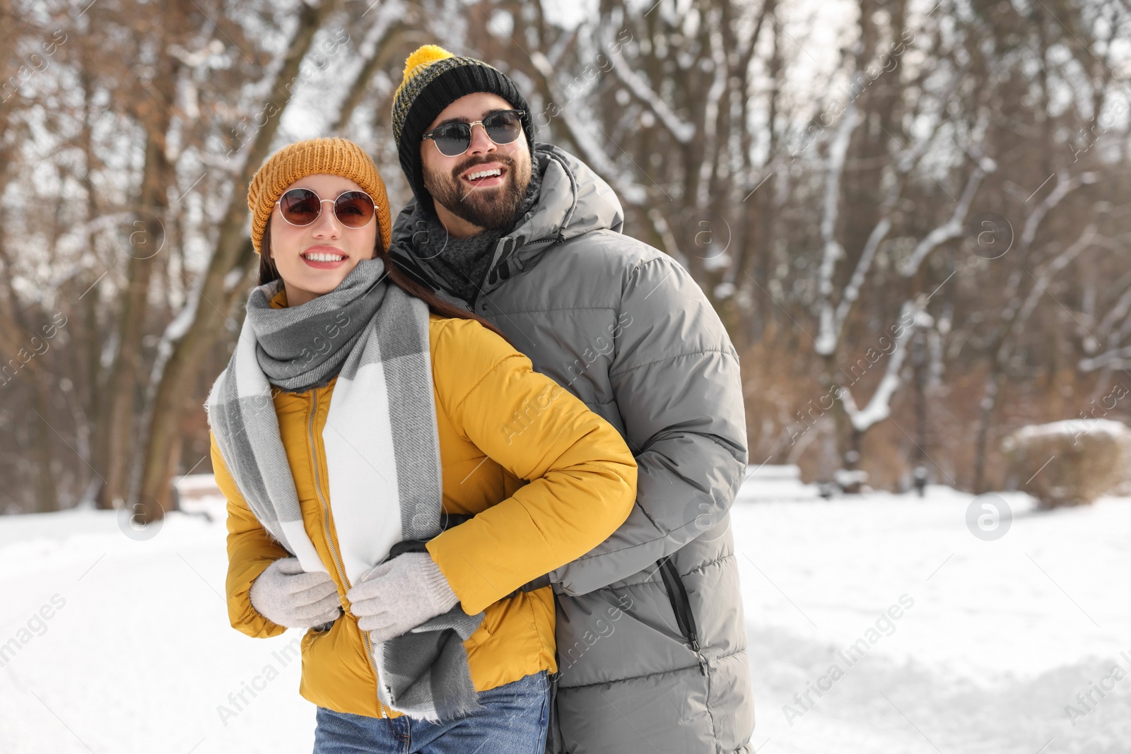 Photo of Beautiful happy couple spending time together on winter day