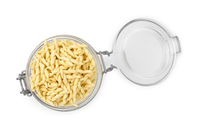 Photo of Uncooked trofie pasta in glass jar isolated on white, top view