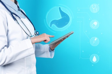 Gastroenterologist with tablet and virtual image of stomach on turquoise background, closeup