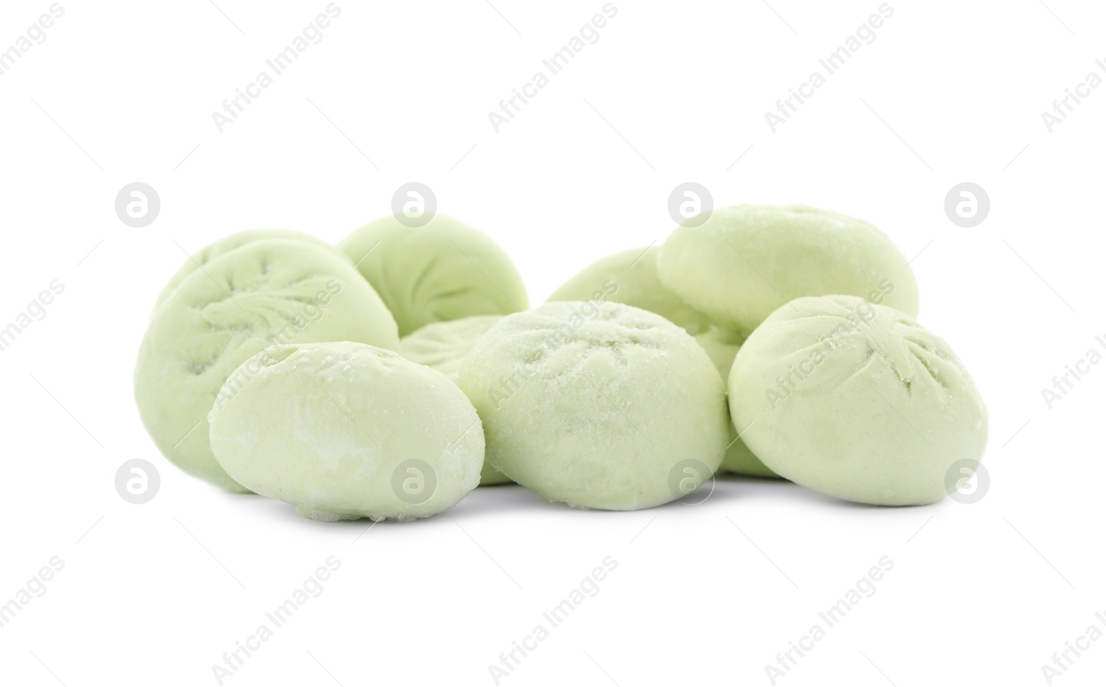 Photo of Heap of raw dumplings with tasty filling on white background