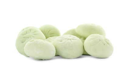 Heap of raw dumplings with tasty filling on white background