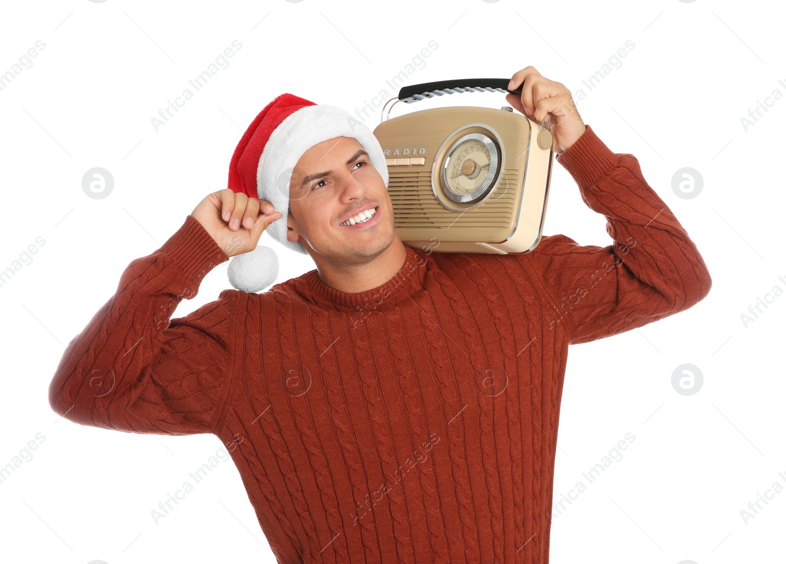 Photo of Happy man with vintage radio on white background. Christmas music