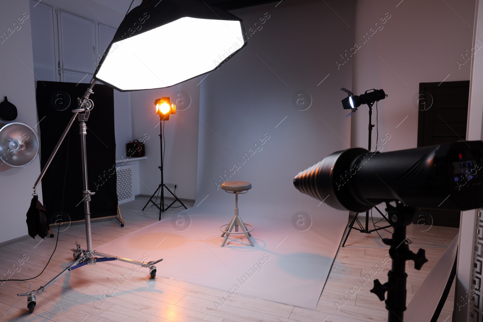 Photo of Casting call. Chair and different equipment in modern studio