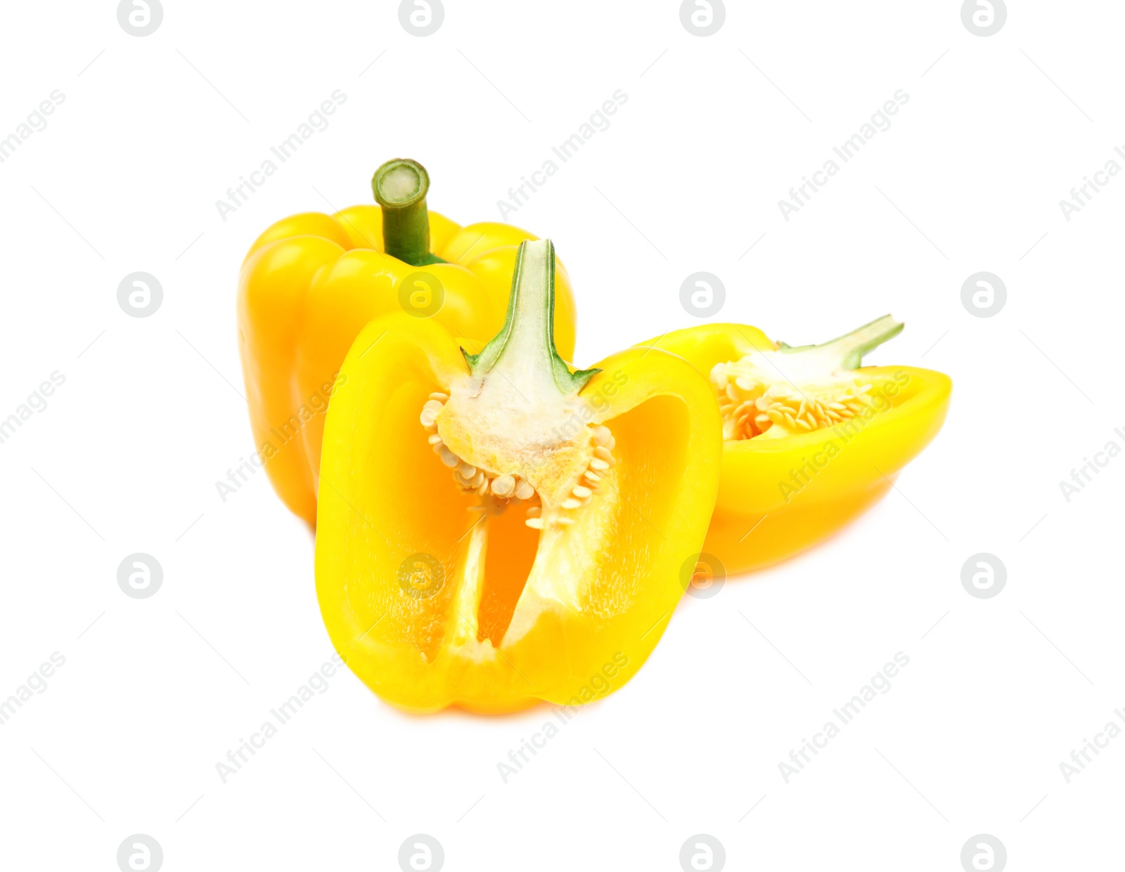 Photo of Whole and cut yellow bell peppers on white background