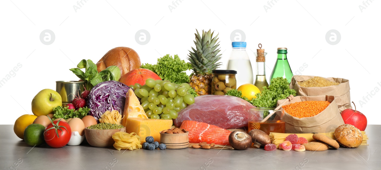 Photo of Different products on grey table. Healthy food and balanced diet