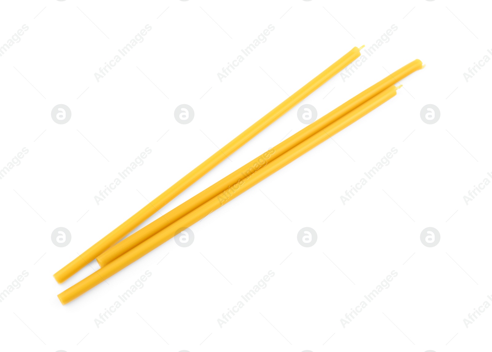 Photo of New church candles on white background, top view