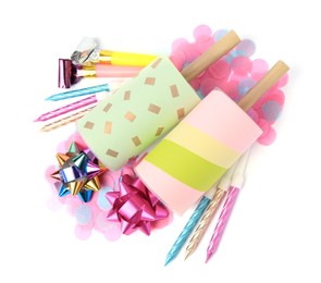 Photo of Party crackers and different festive items on white background, top view