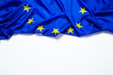 Photo of Flag of European Union on white background, top view. Space for text