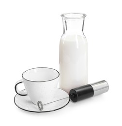 Photo of Mini mixer (milk frother), cup and bottle isolated on white