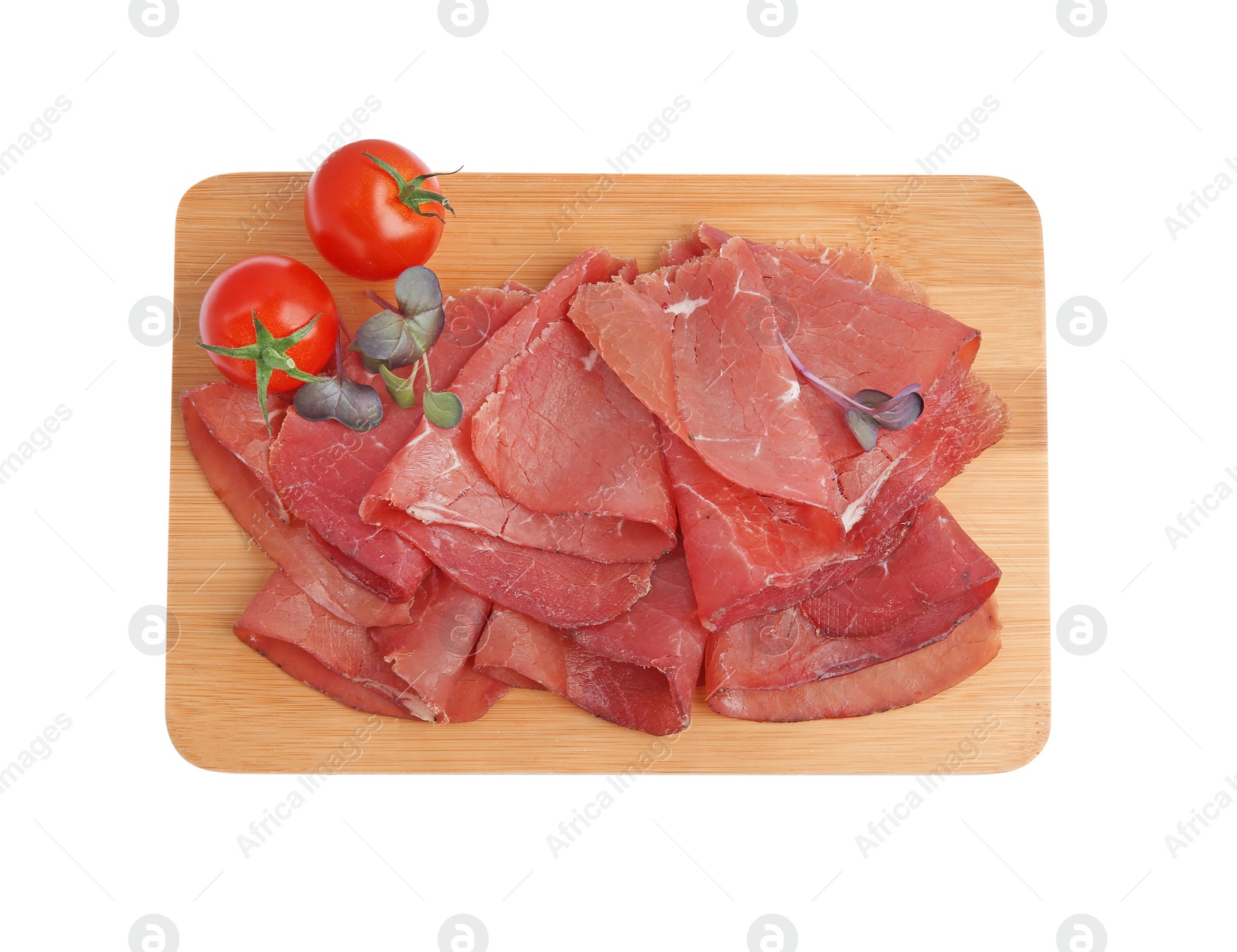 Photo of Slices of tasty bresaola and tomatoes isolated on white, top view