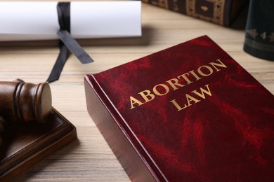 Abortion Law book and gavel on wooden table