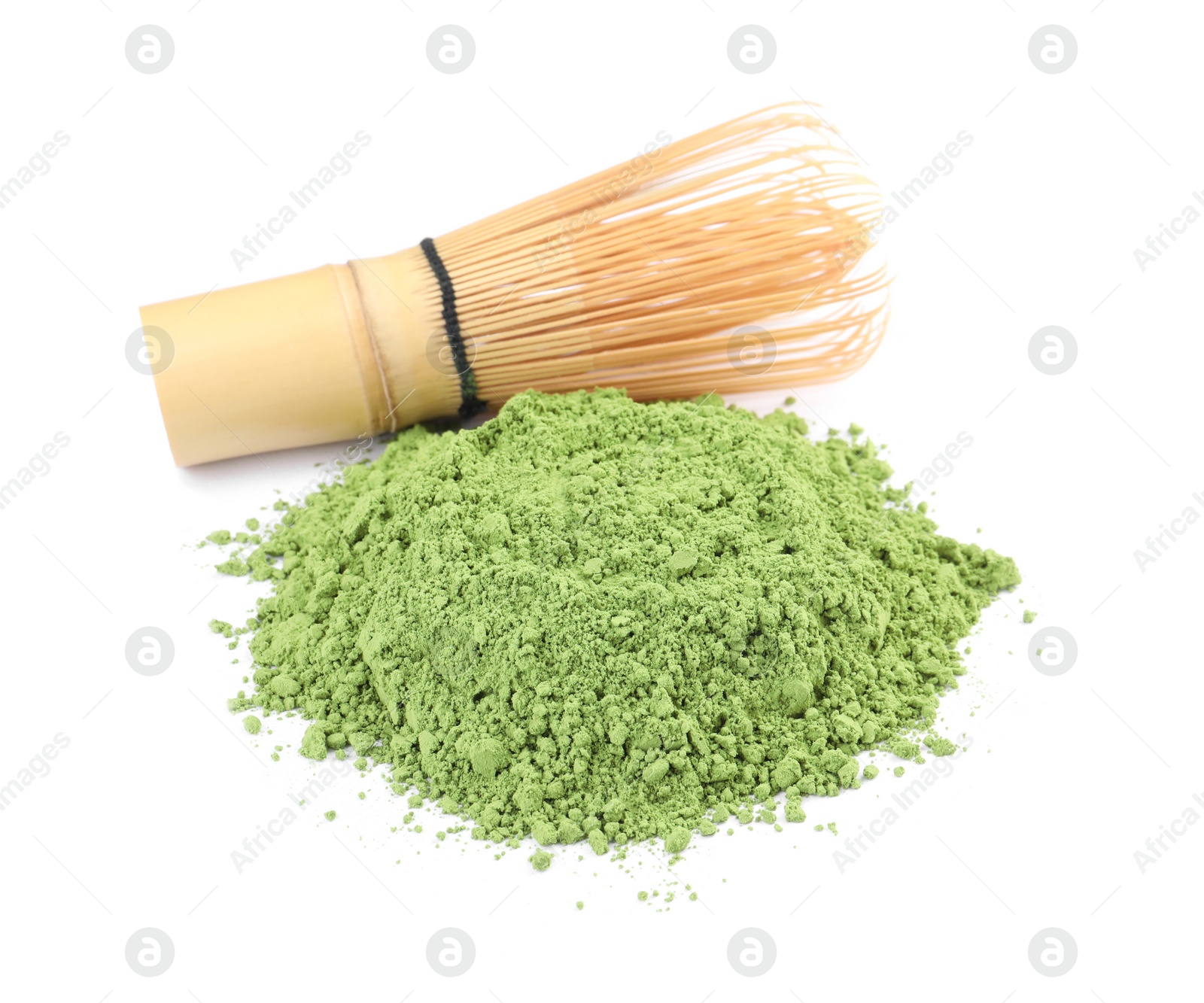 Photo of Pile of green matcha powder and bamboo whisk isolated on white