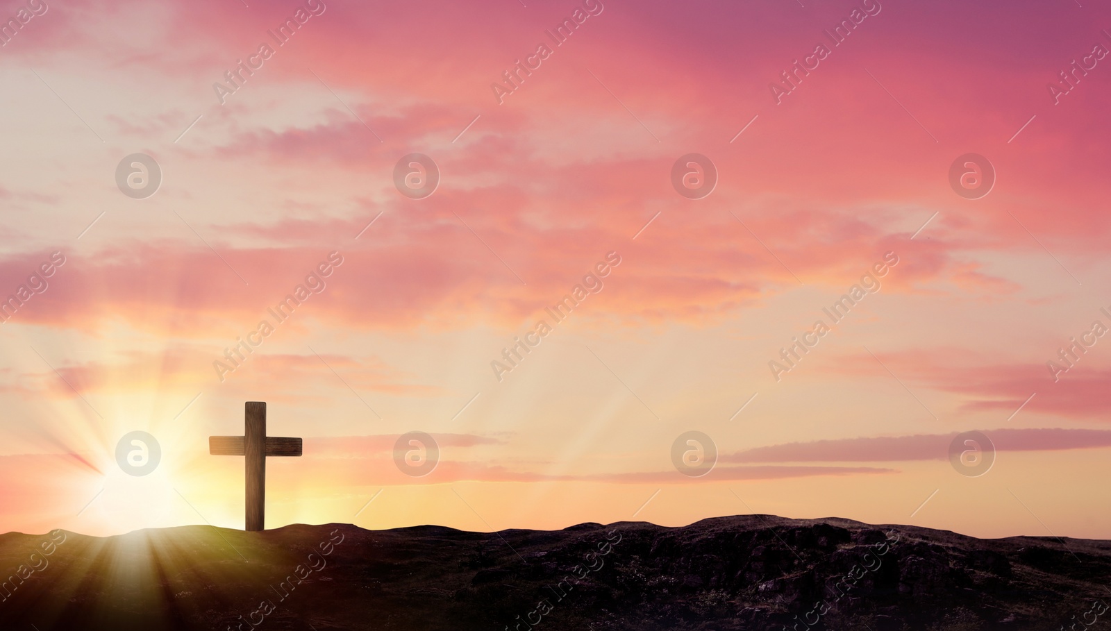 Image of Christian cross on hill outdoors at sunrise. Resurrection of Jesus