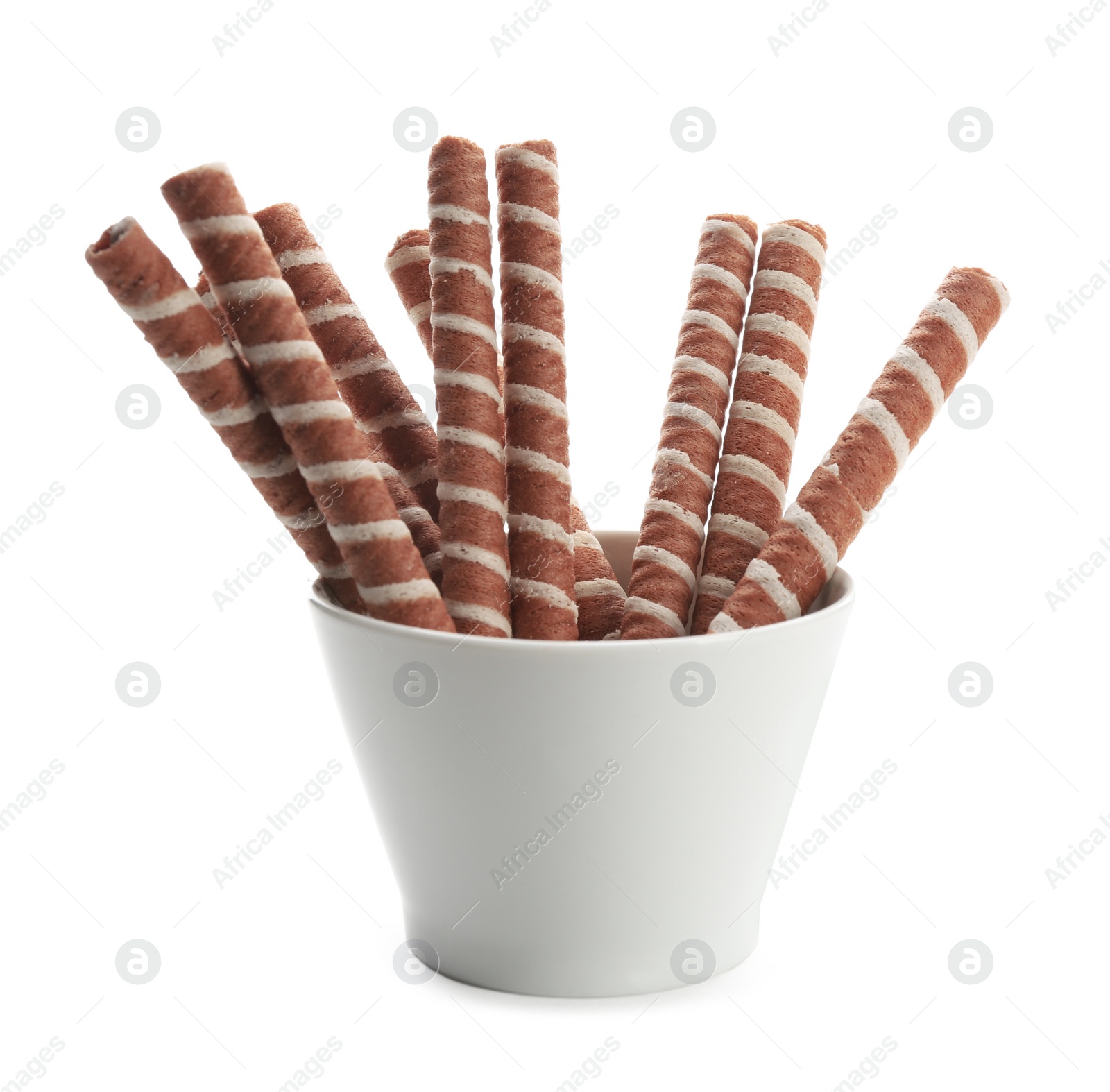 Photo of Bowl with tasty wafer roll sticks on white background. Crispy food