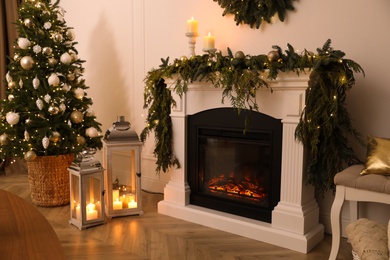 Photo of Beautiful room interior with fireplace and Christmas decor