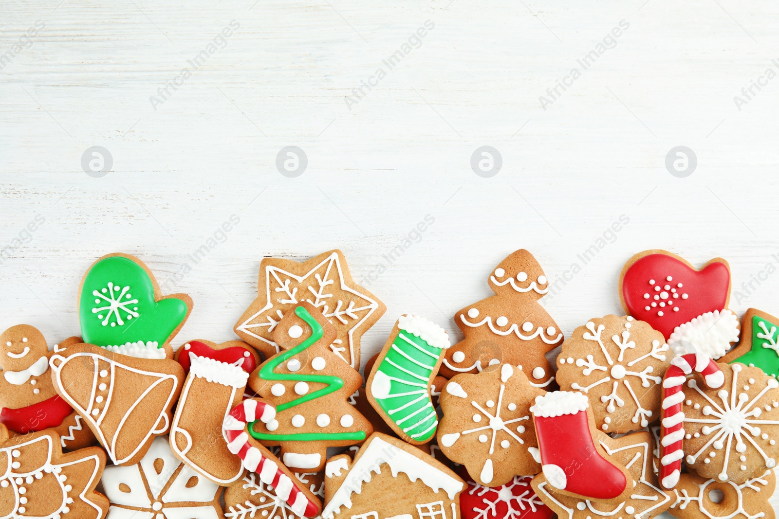 Photo of Tasty homemade Christmas cookies on wooden background, top view