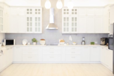 Photo of Blurred view of modern kitchen. Interior design