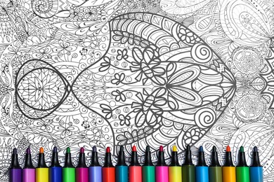 Felt tip pens on antistress coloring page, top view