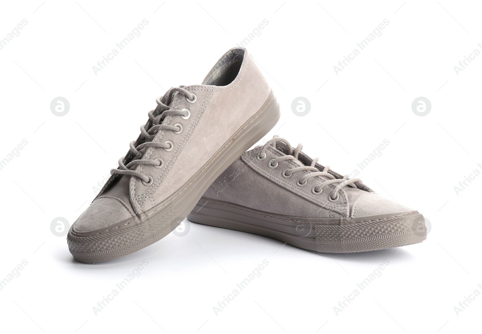 Photo of Pair of stylish sneakers on white background