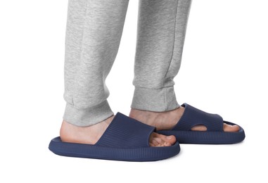 Photo of Man in blue slippers on white background, closeup