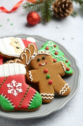Tasty homemade Christmas cookies on light grey table