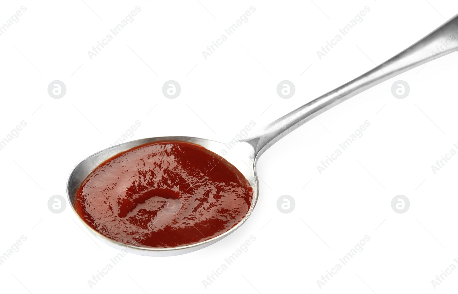 Photo of Spoon with hot barbecue sauce on white background