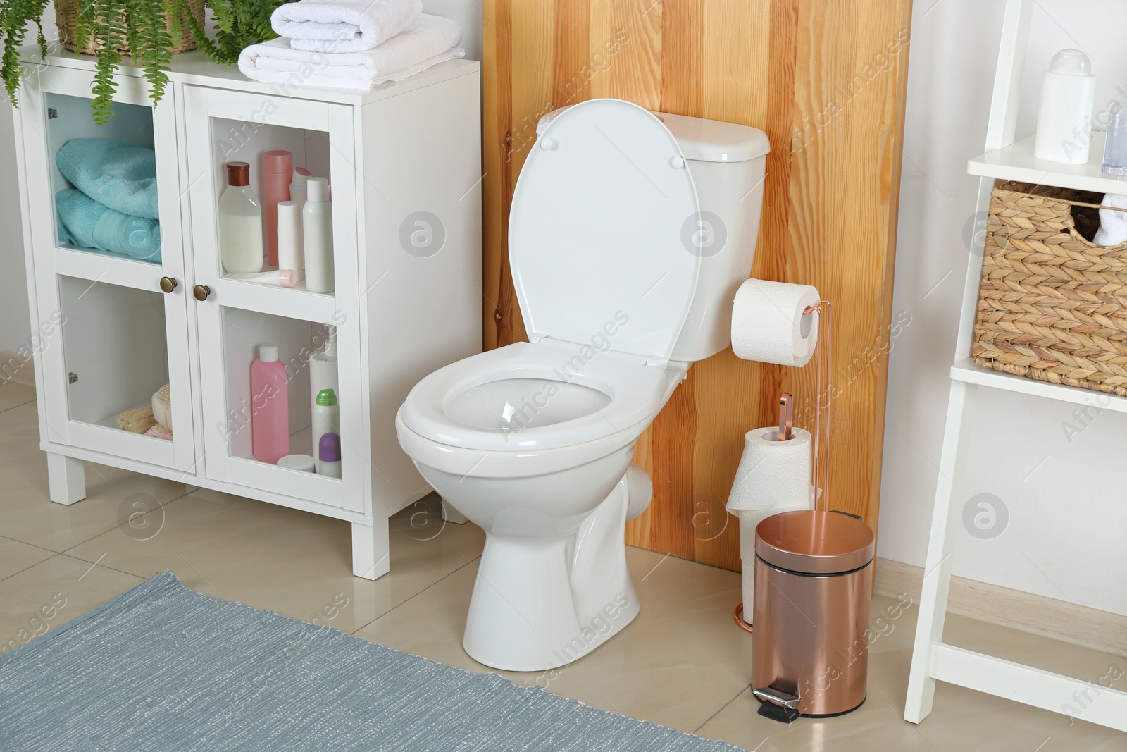 Photo of Stylish toilet bowl in modern bathroom interior