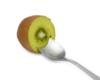 Photo of Fresh ripe yellow kiwi with spoon isolated on white