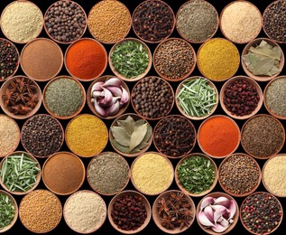 Image of Collection of different aromatic spices and herbs on black background, flat lay