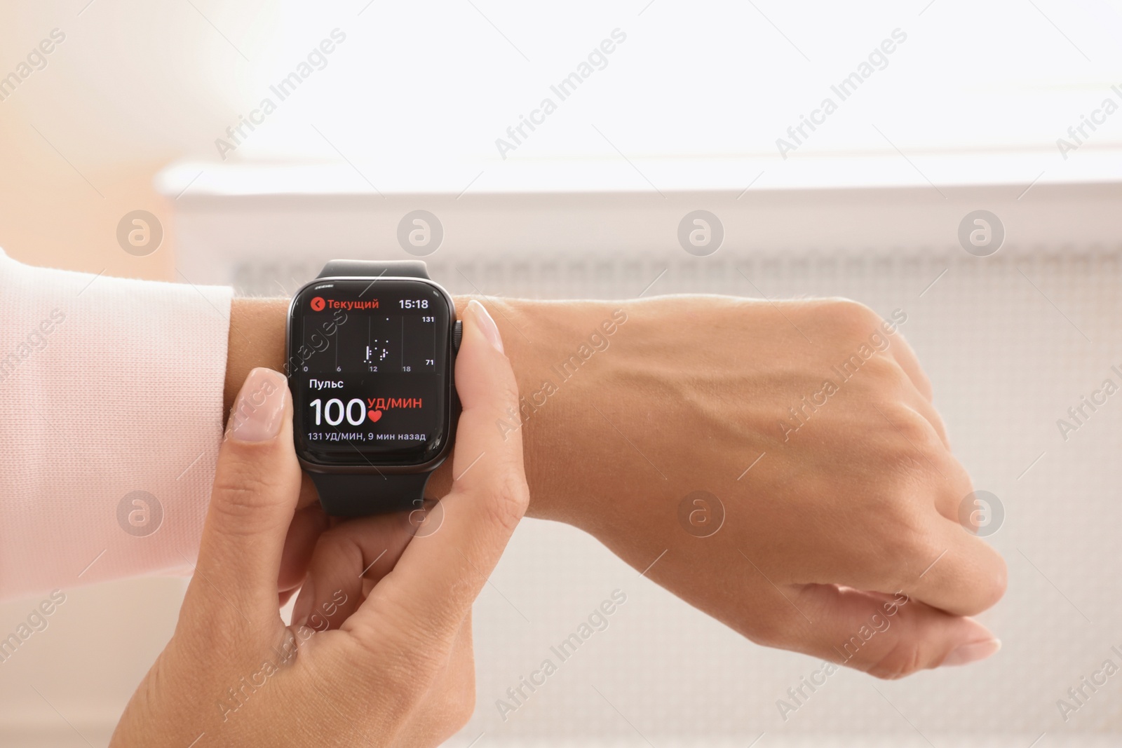 Image of MYKOLAIV, UKRAINE - SEPTEMBER 19, 2019: Woman with Apple Watch checking heart rate at home, closeup