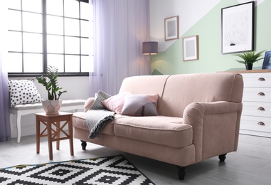 Photo of Beautiful living room interior with comfortable sofa