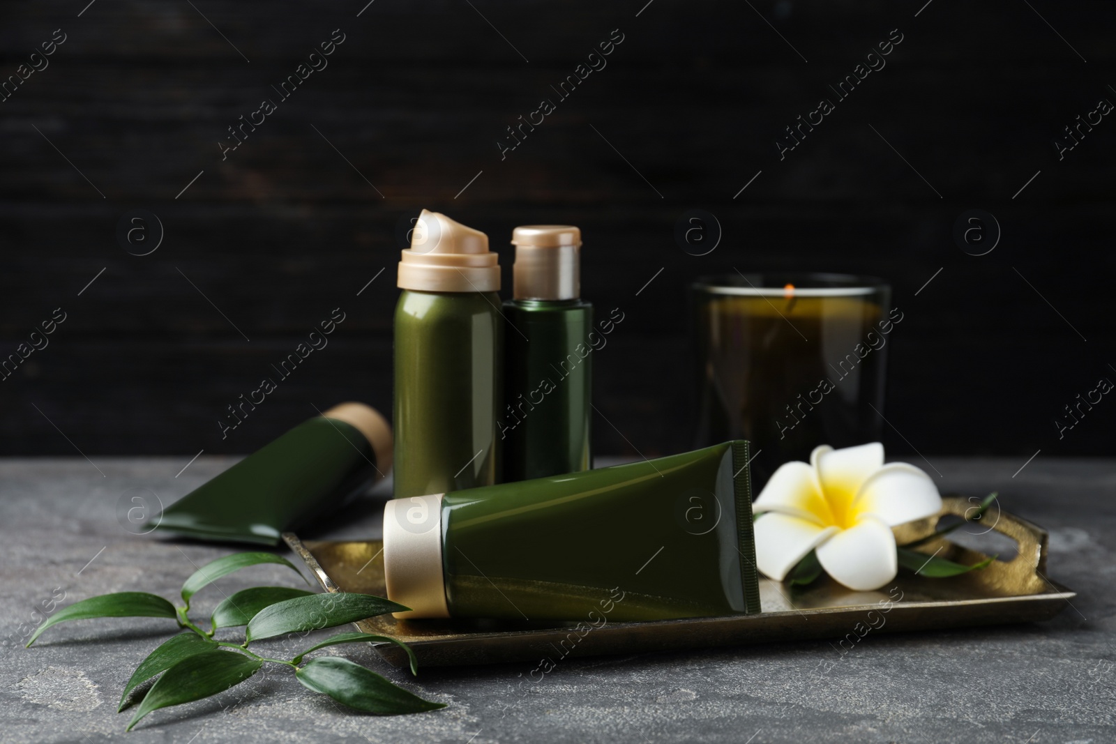 Photo of Composition with cosmetic products on grey table