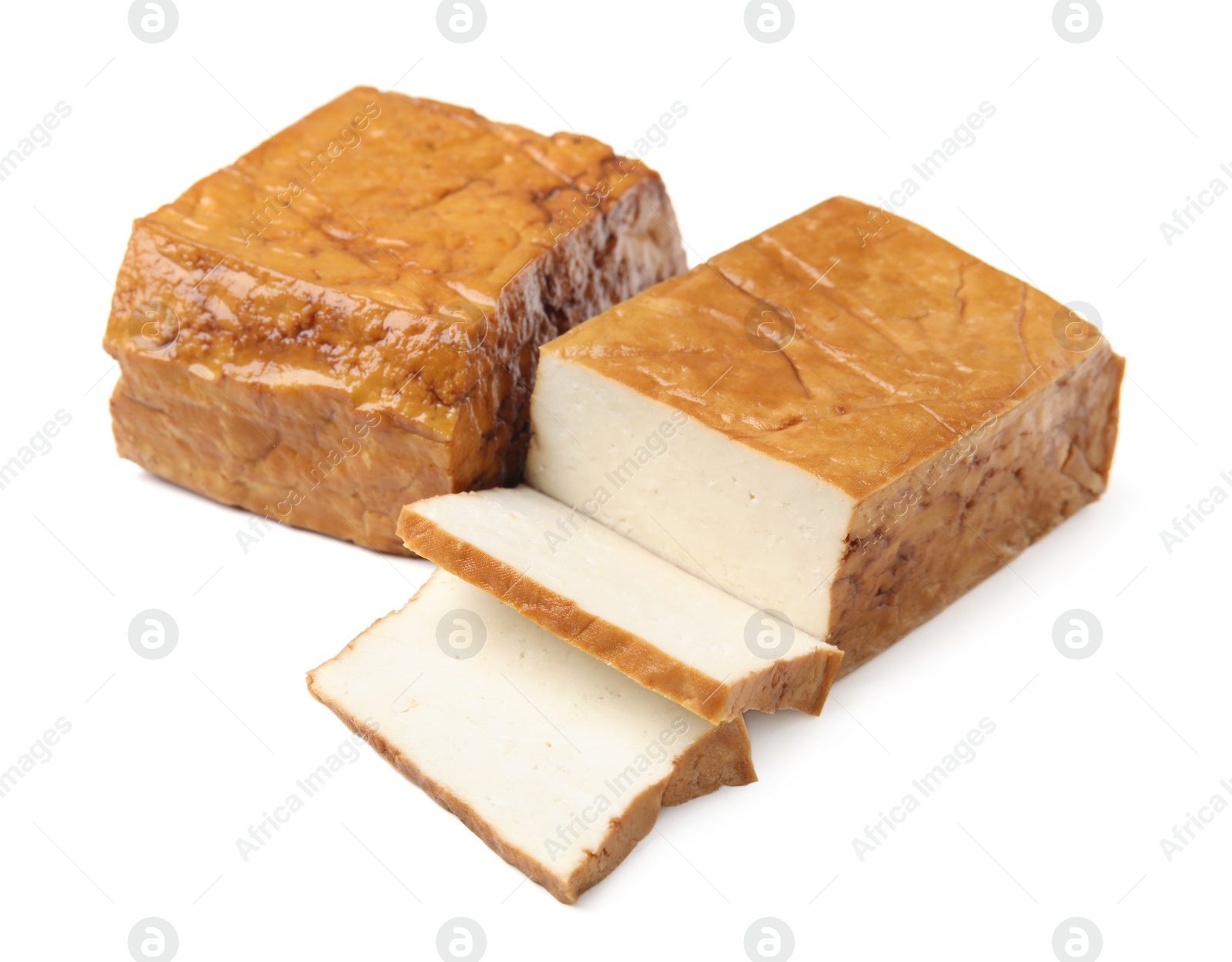 Photo of CUt smoked tofu cheese on white background