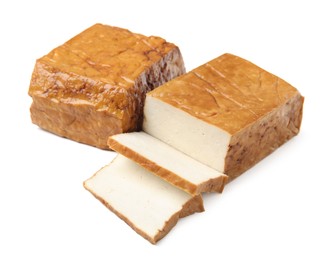 Photo of CUt smoked tofu cheese on white background