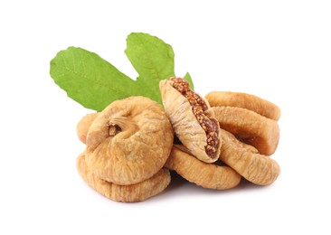 Photo of Tasty dried figs and green leaf isolated on white