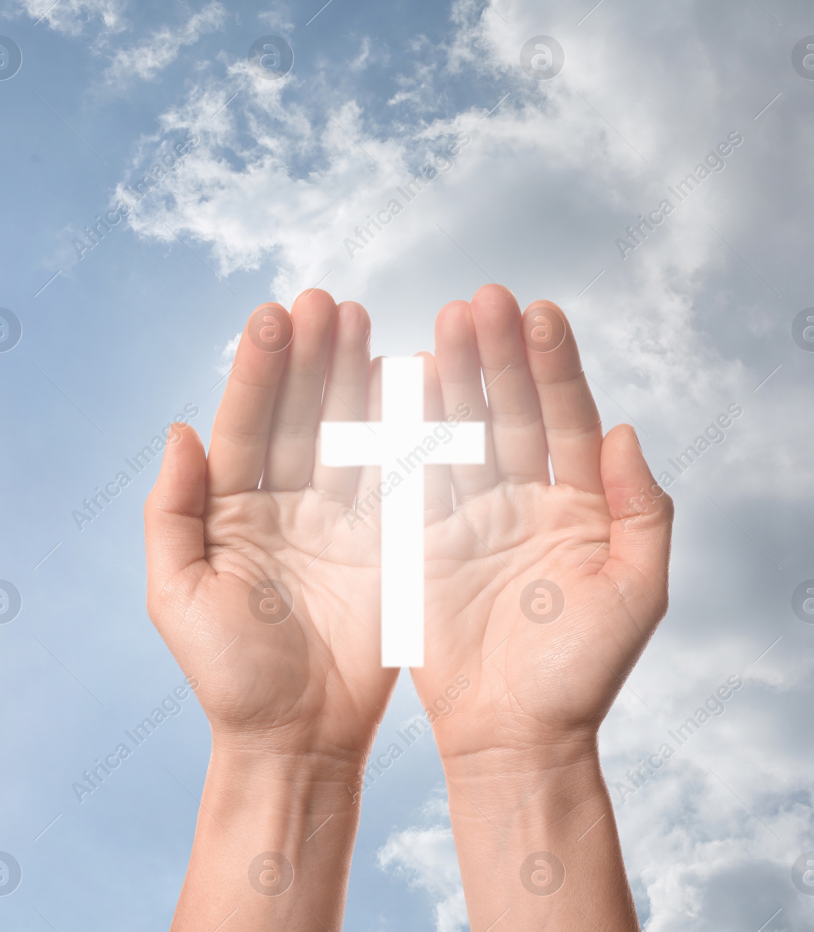 Image of Religion. Christian woman with glowing cross praying against sky, closeup