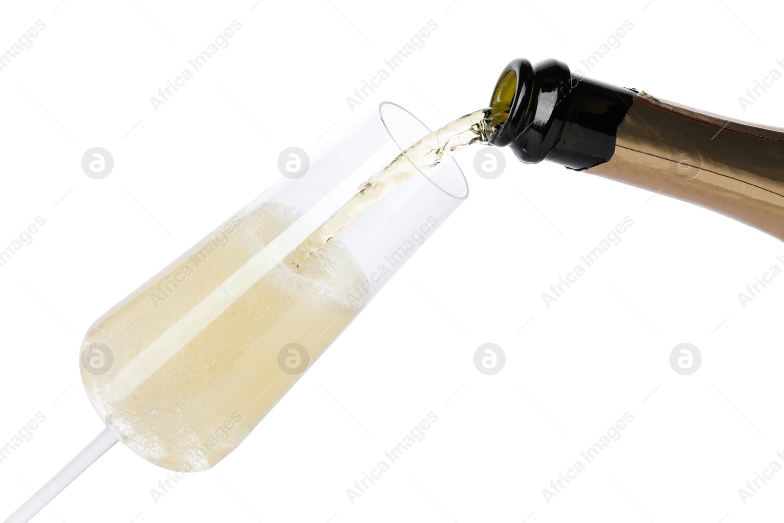 Photo of Champagne pouring from bottle into glass isolated on white