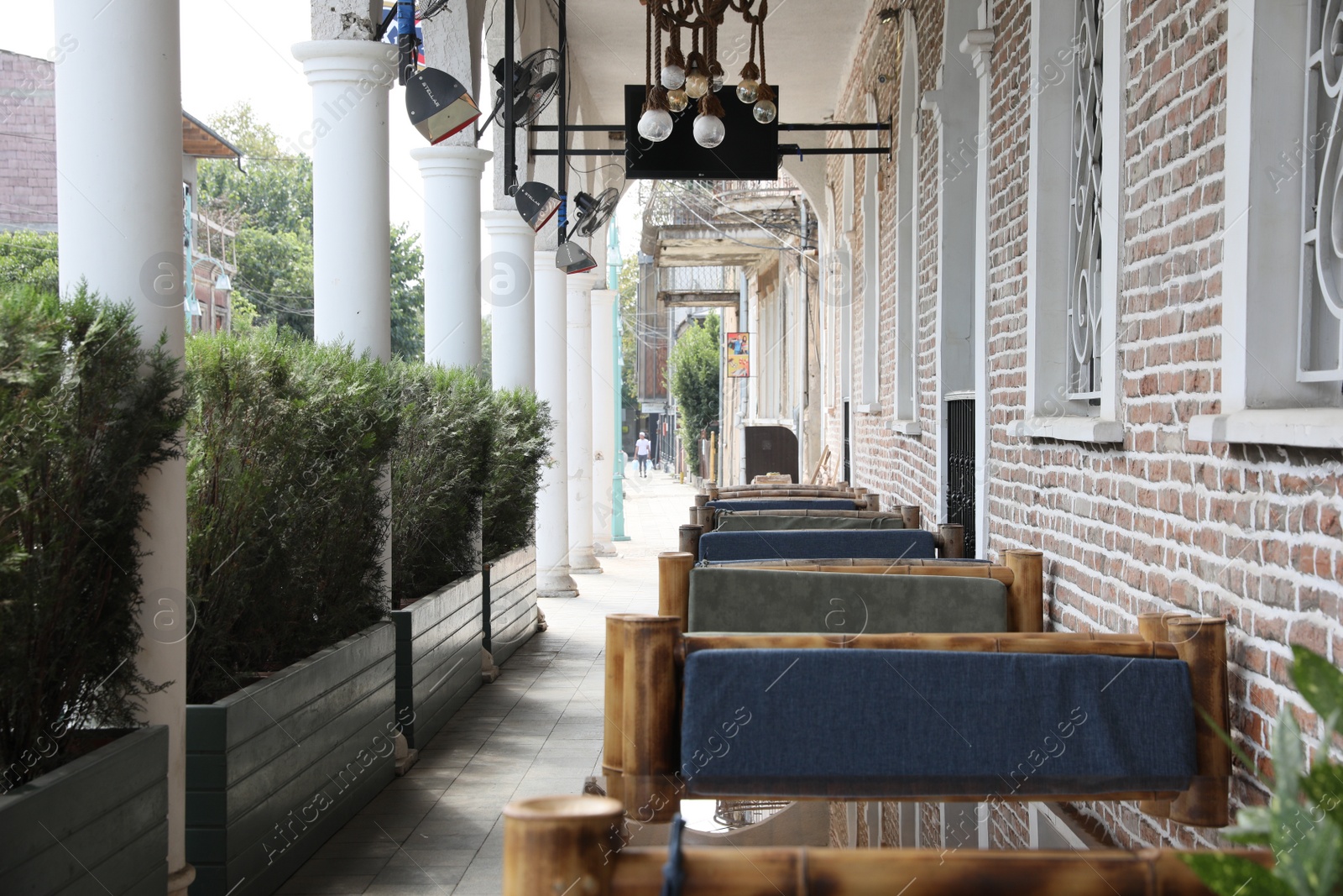 Photo of Kutaisi, Georgia - September 2, 2022: Beautiful wooden furniture near building outdoors