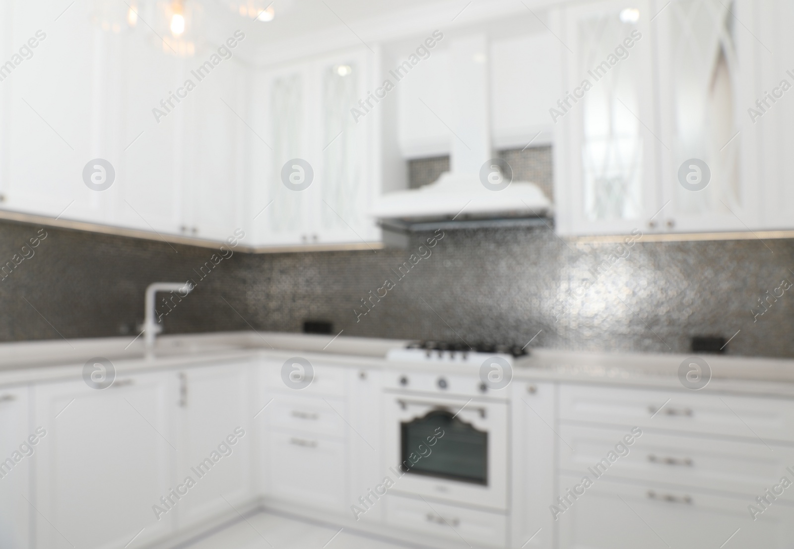 Photo of Blurred view of beautiful kitchen interior with new stylish furniture