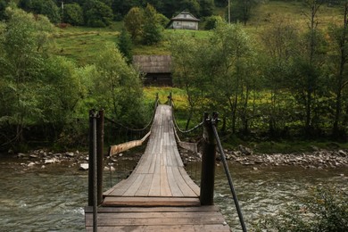 Beautiful view of wooden bridge over river