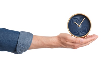 Photo of Young man holding clock on white background. Time management
