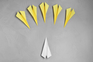 Flat lay composition with paper planes on light grey table